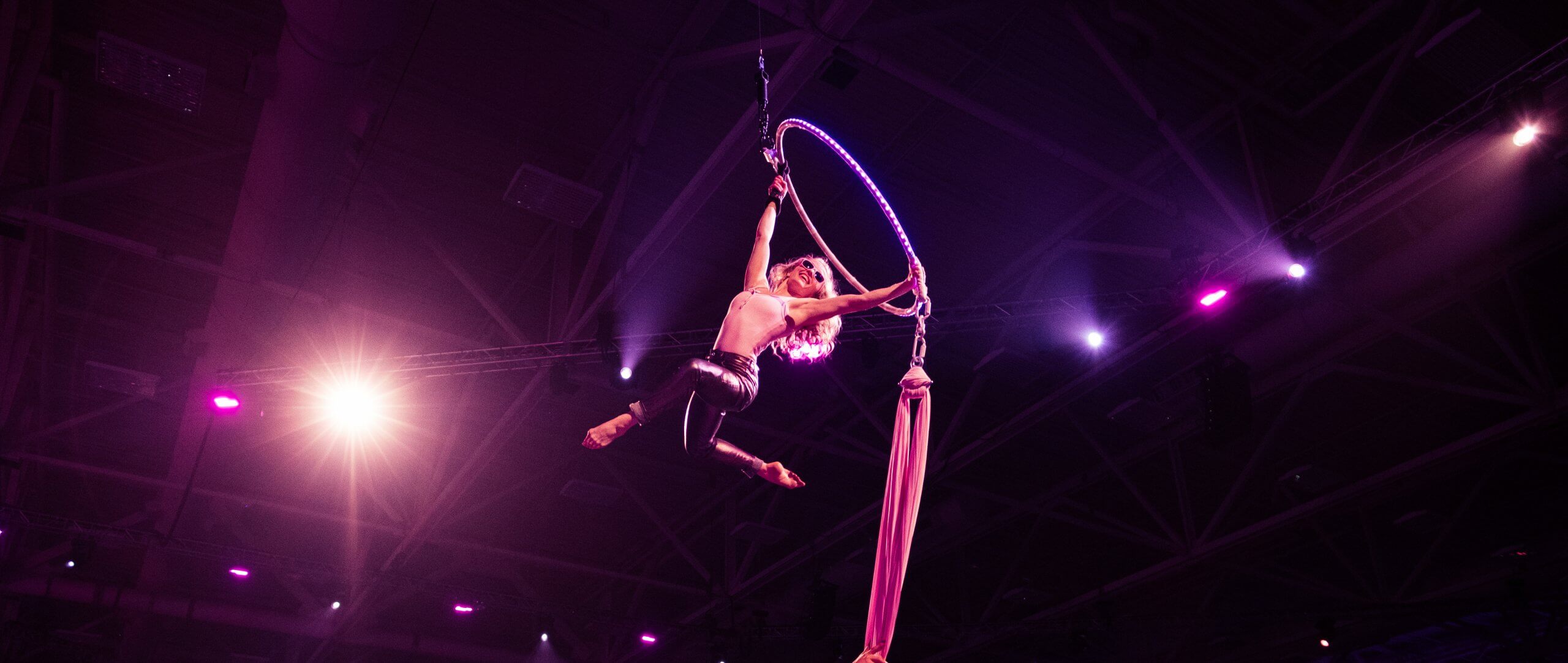 performer on stage at cosmetics conference